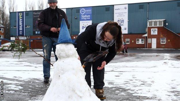 Supporters have to make snowmen after Bury v AFC Wimbledon was postponed