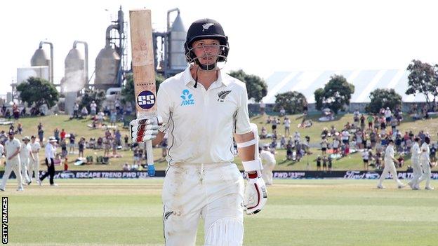 New Zealand batsman BJ Watling raises his bat as he walks off after hitting 205 against England in the first Test