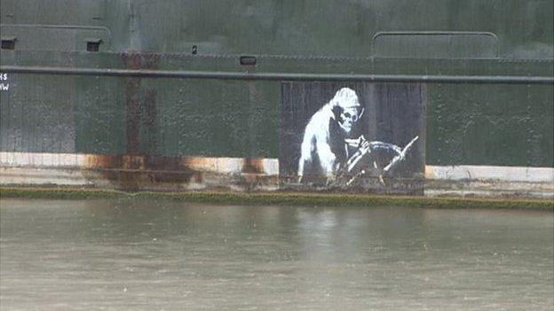 Banksy's Grim Reaper image seen on the side of the ship