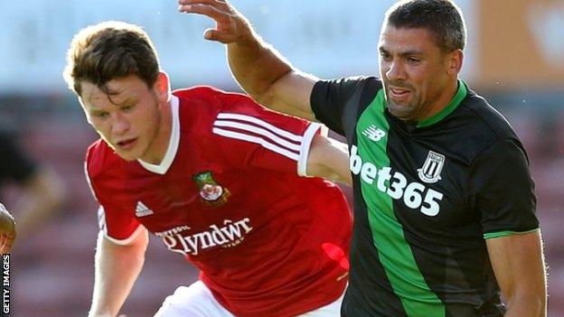 Connor Jennings (left) in action against Stoke City's Jon Walters