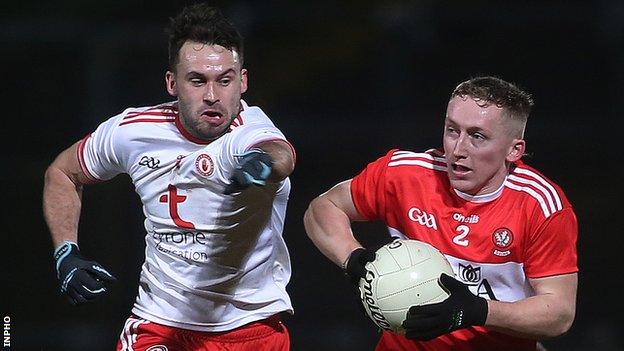Tyrone's Kyle Coney challenges Derry's Sean Quinn