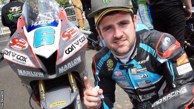 Michael Dunlop celebrates the Supersport win which was his 27th podium finish in 40 Isle of Man TT races