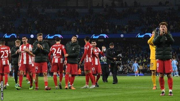 Atletico Madrid players applaud fans