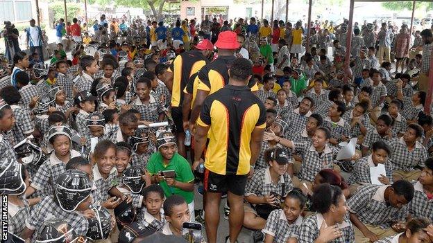 PNG players attend a function at a school