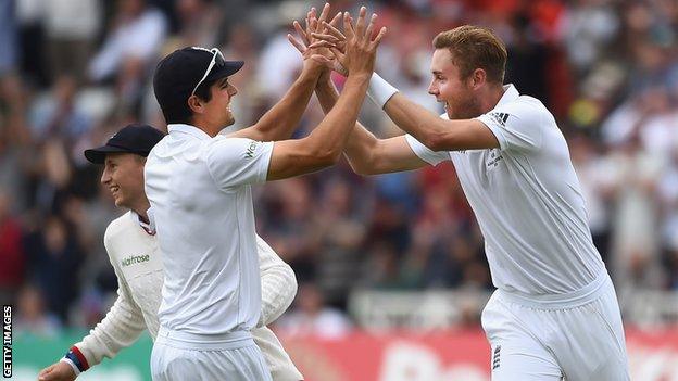 Stuart Broad celebrates a wicket with Alastair Cook