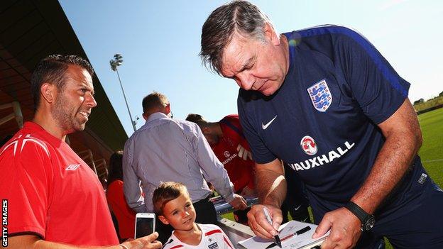 Sam Allardyce signs autographs