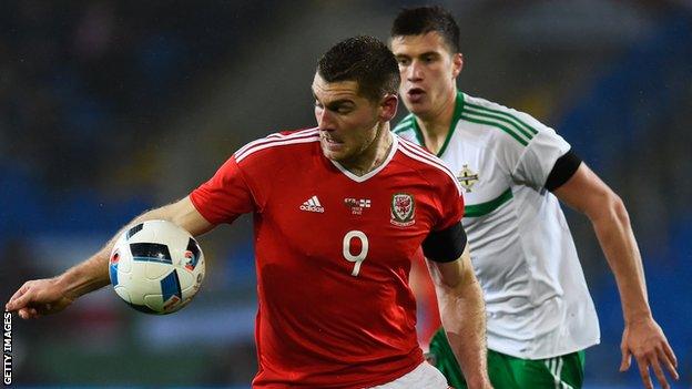 Northern Ireland's Paddy McNair shadows Sam Vokes in Thursday's friendly in Cardiff