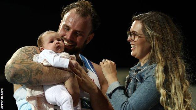 Aled Davies was reunited with his fiancee and eight-week-old daughter Phoebe after winning gold