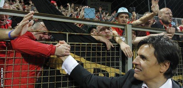 Chris Coleman celebrates with Wales fans