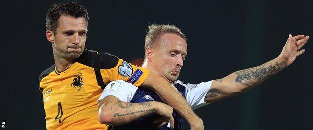 Lithuania's Tadas Kijanskas holds off Scotland's Leigh Griffiths