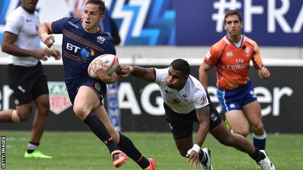 Mark Robertson gets away from Fiji's Vatemo Ravouvou at the recent HSBC World Rugby Sevens Series in Paris