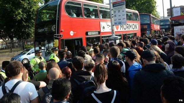 Commuters queue for buses during London tube strike