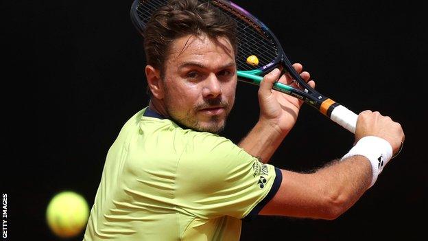 Stan Wawrinka returns a ball against Reilly Opelka at the Italian Open