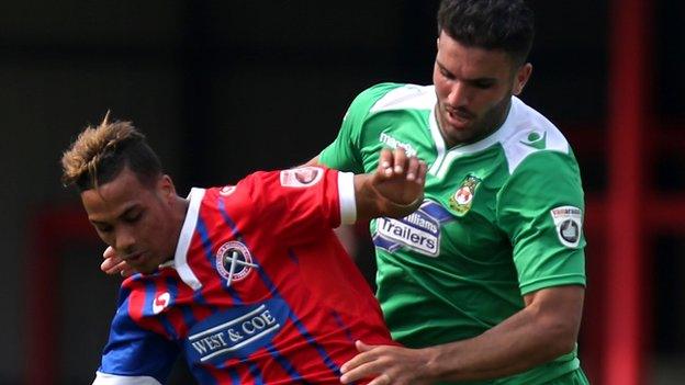 Wrexham's Hamza Bencherif (right) in action against Dagenham & Redbridge