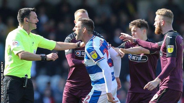 Angel Rangel clashes with Swansea City players during QPR's 4-0 Championship win