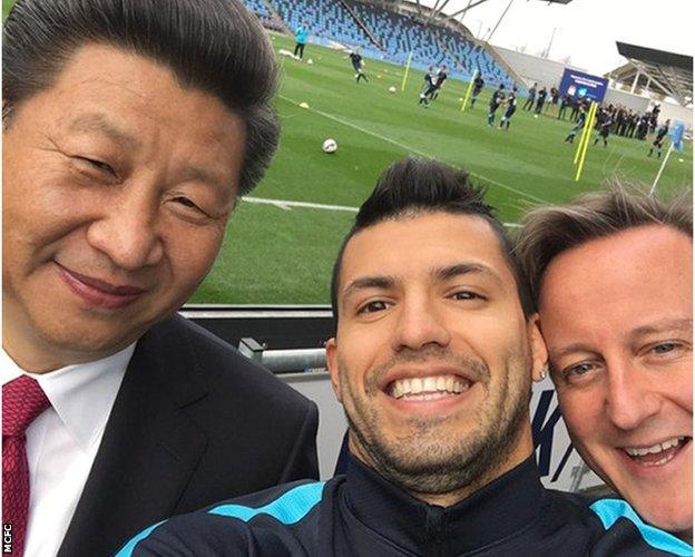 Manchester City's Sergio Aguero with China President Xi and British Prime Minister David Cameron during during the China leader's state visit in October 2015