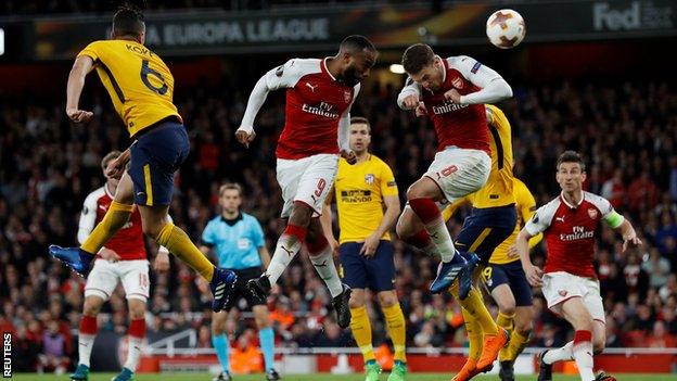 Alexandre Lacazette heads Arsenal's goal against Atletico Madrid