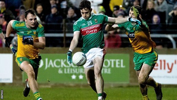 James Durcan gets in a shot despite the efforts of Caolan Ward