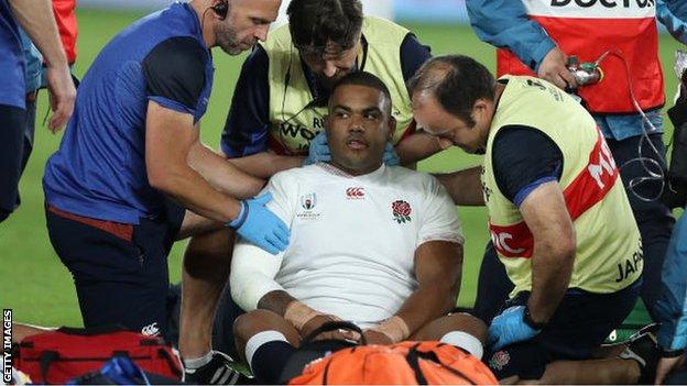 Kyle Sinckler receives treatment on the pitch during the World Cup final