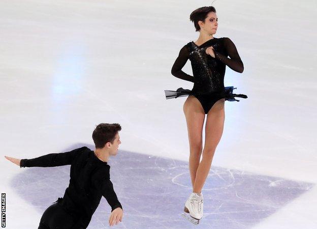 Natalya Zabiyako and Alexander Enbert perform a throw in the pairs