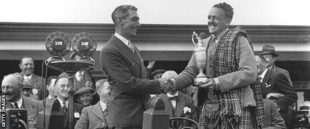 Tommy Armour receives the Claret Jug after winning the 1931 Open Championship