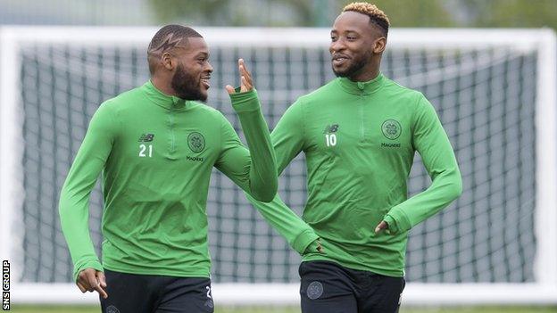 Moussa Dembele chats with Olivier Ntcham at Celtic training