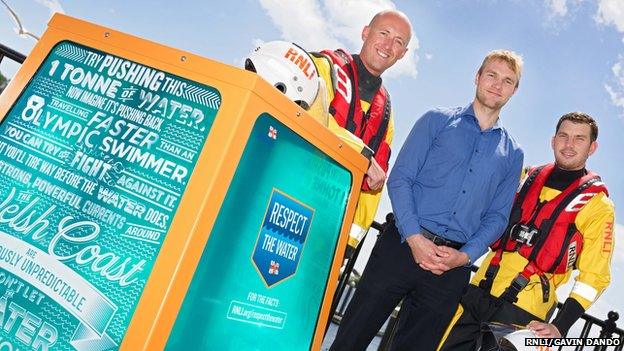 Porthcawl RNLI volunteer Chris Page, rescued bodyboarder Jerome Kirby and RNLI volunteer Chris Missen