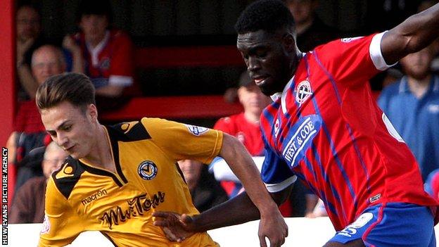 Aaron Collins (left) leads a Newport County attack against Dagenham & Redbridge