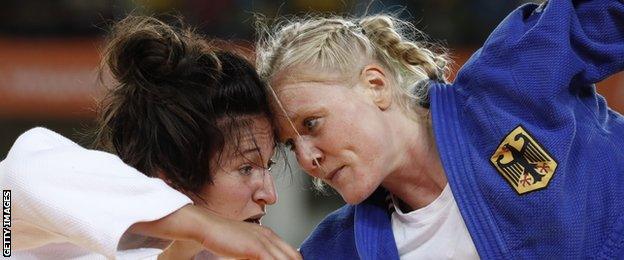 Great Britain's Natalie Powell (white) competes with Germany's Luise Malzahn during their women's -78kg judo contest repechage match of the Rio 2016 Olympic Games in Rio de Janeiro