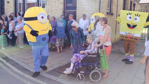 Protestors gather outside Barclays Bank in Littleport