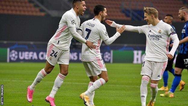 Martin Odegaard, right, celebrates a Real Madrid goal against Inter