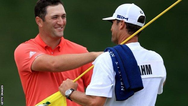 Jon Rahm celebrates his Memorial Tournament win with his caddie