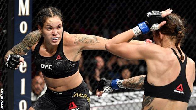 Amanda Nunes of Brazil strikes Germaine de Randamie of Netherlands