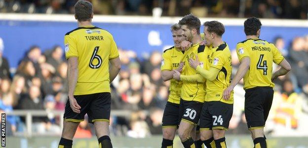 Luke Murphy is congratulated after putting Burton ahead in the first half