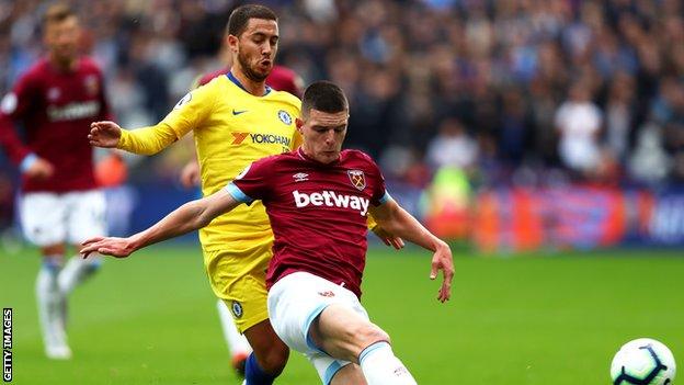 Declan Rice holds off Chelsea's Eden Hazard on Sunday