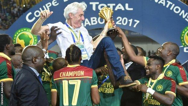 Cameroon boss Hugo Broos is lifted aloft by his players