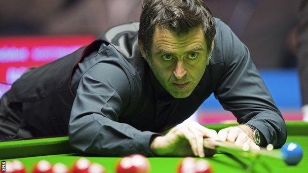 Ronnie O'Sullivan plays a shot against Robert Milkin