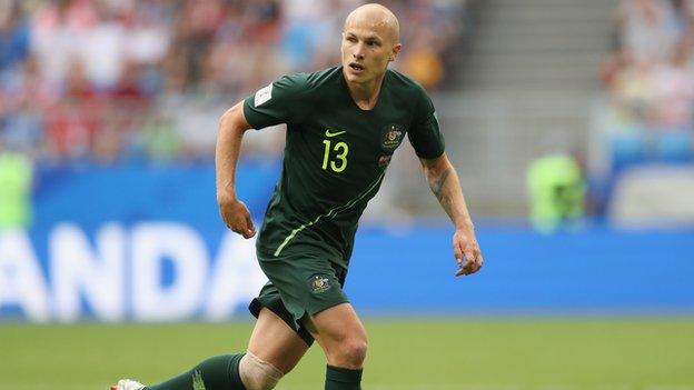 Aaron Mooy playing for Australia