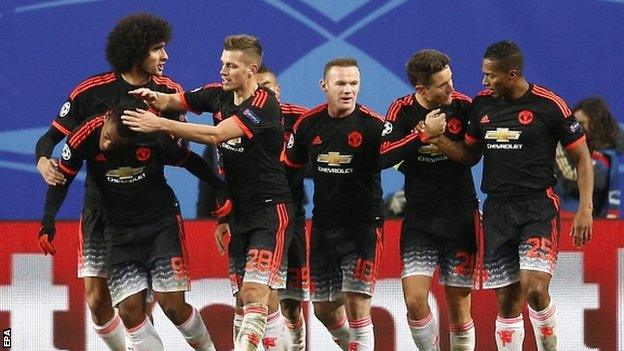 Manchester United celebrate the strike of Anthony Martial (far left)