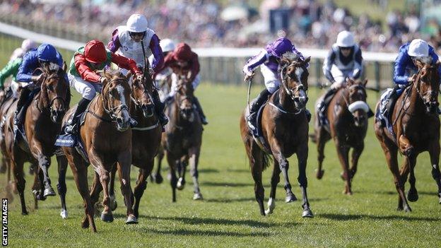 Billesdon Brook and Sean Levey (red and green colours) race to 1,000 Guineas victory