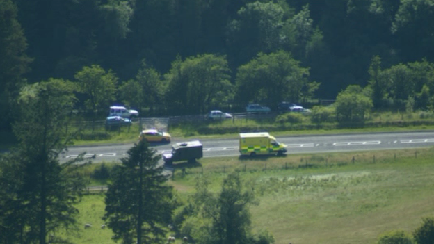 Military and emergency vehicles at the scene of the deaths in the Brecon Beacons