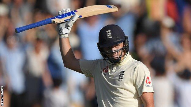 England batsman Ollie Pope raises his bat after passing 50 on day one of the second Test against South Africa in Cape Town