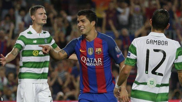 Barcelona's Luis Suarez celebrates scoring against Celtic