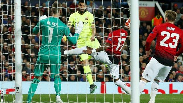 Luis Suarez heads in off Luke Shaw