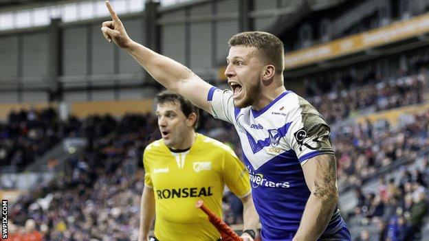 St Helens' Matthew Costello celebrates his try against Hull FC