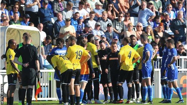 Hartlepool and Dover players during the game's break in play