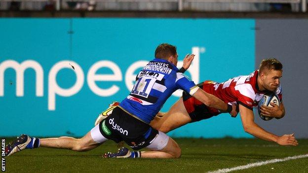 Gloucester's Chris Harris gets past Ruaridh McConnochie to score a try