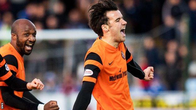 Scott Fraser celebrates his goal for Dundee United