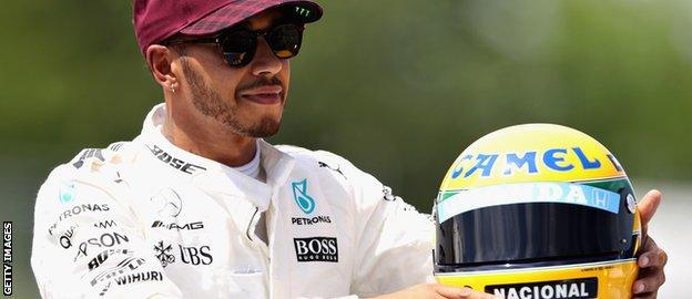 Lewis Hamilton with Ayrton Senna's helmet