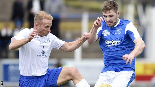 Queen of the South's Stevie Bowey and Kyle Hutton, playing for a Rangers select